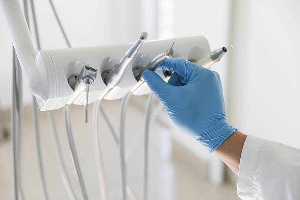 Professional Tooth Extraction technician working in Kiln, MS